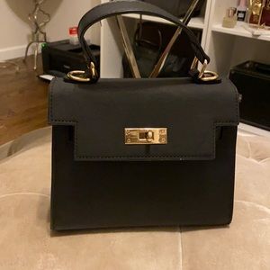 Small black crossbody bag with gold hardware
